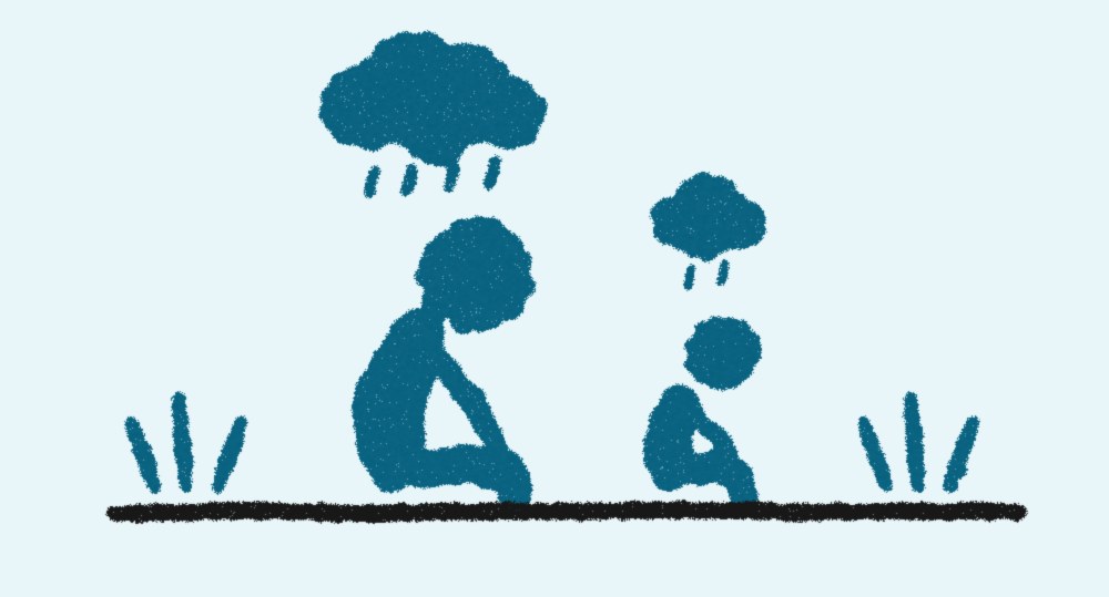 雨雲の下でうつむいて座る大人と子ども